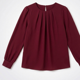 Blouse plissée rouge bordeaux présentée à plat