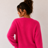 Dos du cardigan magenta en gros plan