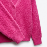 Détail de la maille duveteuse et des poignets côtelés