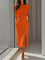 Robe midi crayon orange à boutons et fente devant